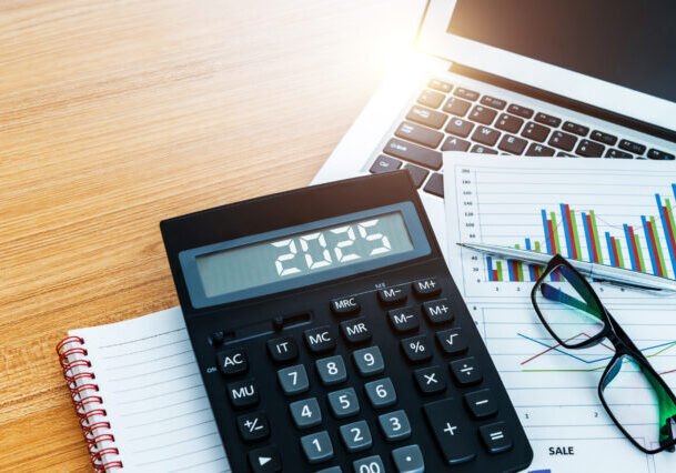 New year number 2025 on the calculator screen,  at financial analysis desk